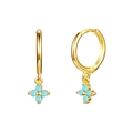 Close-up of gold hoop earrings with light blue four-petal floral dangles on white background - Clover Blue Bead Gold