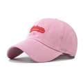 Close-up of pink vintage baseball cap with red 3D embroidery and cotton twill texture - Adjustable / Pink
