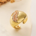 Luxurious wide gold geometric hoop earring with sparkling zircon insets on a beige background - Wide Band Zirconia Open Style (14353)