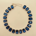 Detail view of rectangular blue crystal necklace with gold-plated link chain - Dark Blue