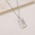 Detail of silver rectangle pendant featuring hammered texture and a sunburst star pattern - Sunburst Rectangle Tag (NKS-002_06A)
