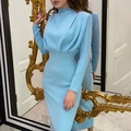 Detail of sky blue long sleeve dress with high neck pleated chest design shown in mirror - S / Light Blue