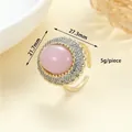 Vintage style gold ring featuring an oval pink gemstone surrounded by sparkling zircons - R-0158 Pink Gemstone Open Ring / Gold