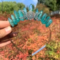 Detail showing blue crystal cluster crown with triple moon goddess metal ornament - AB Green Crystal with Triple Moon