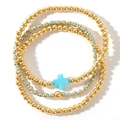 Dreiteiliges goldenes Perlenarmband-Set mit türkisen Perlen und einem Kreuzanhänger - Kreuz 3-Teiliges Set / Gold/Blaugrün
