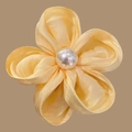 Elegant pale yellow flower hair scrunchie with center pearl on tan background - Yellow Hair Clip