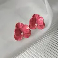 Macro shot of 14K gold-plated floral earrings with pink petals and a crystal center - Magenta Pink 3D Artistic Flower (A823)