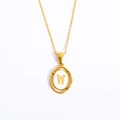 Detail of gold oval pendant with white enamel inlay showing letter W on fine chain - Letter W - Gold