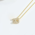 Golden twist chain necklace with micro-pave letter P pendant and crystal details - Letter R