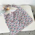 Detail of floral canvas shoulder bag showing soft fabric texture and colorful patterns - Beige Floral