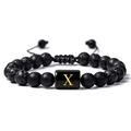 Détail du bracelet ajustable en pierre de lave avec cylindre doré et lettre X - Lettre X(X)