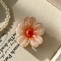 Pink translucent resin flower hair claw clip with orange center on beige canvas - 4cm / Glossy Plum Orange