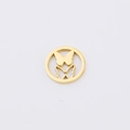 Detailed macro view of golden hollow butterfly circular pendant for DIY jewelry - Butterfly