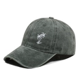 Detailed close-up of white coconut tree embroidery on a dark grey washed cotton baseball cap - One Size / Army Green