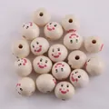 Macro view of 20mm natural wood beads featuring pink blush smiley face for DIY jewelry - Hannya Mask