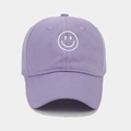 Detail of white smiley face embroidery on a soft purple cotton baseball cap - Light Purple