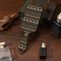 Detail view of Bohemian air cushion hairbrush with geometric patterns on a vintage wooden desk - Customizable Pattern / Dark Brown