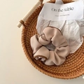 Chic beige ballet style scrunchie with dark brown piping on a rustic tray - Khaki Goddess Contrast