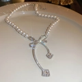 Elegant silver bow pearl choker necklace with sparkling rhinestones on a white plate - Pearl Bowknot Style (24#) / White