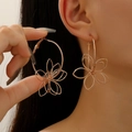 Close-up of model wearing oversized hollow metal flower earrings in rose gold finish - Rose Gold Hollow Flower Earrings (06 KC Gold 1900)