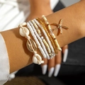 Boheemse meerlaagse kralenarmbandset met natuurlijke schelpen en een zeester hanger - Armbandenset / Beige Gemengde Armband