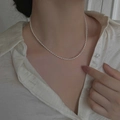 Elegant minimalist white rice pearl necklace on model's neck for a vintage look - Minimalist White Rice Bead Necklace (W-d-011)