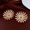Macro shot of gold floral earrings with daisy petal details on elegant silk background - 26# Gold Radial Daisy (Steel Pin)