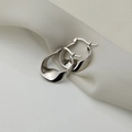 Detailed view of irregular silver wave earrings with S925 mark on white silk - S-E1643-Silver Wavy