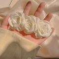 Elegant white camellia hair clip with three handmade fabric roses in a row - Cream