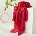 Elegant red linen cotton scarf with frayed edges displayed on a minimalist background - Red / 0.0