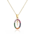 Macro shot of gold oval pendant featuring rainbow cubic zirconia and a movable letter T charm - Letter T