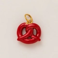 Detail of red enamel pretzel charm pendant with a 18K gold plated metal loop - Pretzel / Red