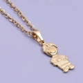 Macro shot of 18k gold plated stainless steel boy pendant with detailed T-shirt texture - Boy Necklace - Gold