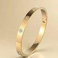 Elegante bracciale rigido dorato con intarsio floreale di cristalli e chiusura a cerniera - Decorazione Strass Fiore di Trifoglio (33-D-5) / Oro