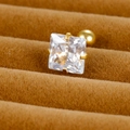 Macro shot of square zircon stud earring with gold four-prong setting and screw back - 7mm / Gold