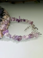 Macro shot of irregular purple amethyst crystal bracelet with adjustable silver lobster clasp - Amethyst