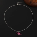 Close-up of a pink AK-47 assault rifle pendant with rhinestones on a silver chain - Silver Chain Pink AK-47 Full Rhinestone (DZ-419)