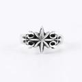 Macro shot of silver vintage star cross ring showing retro textured finish on white background - Adjustable Open / Eight-Pointed Star