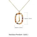 Gold alphabet necklace featuring an oval crystal frame and the letter J pendant - Gold Letter J