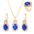 Detailed view of luxury bridal jewelry set with dark blue oval gems and golden finish - Oval KC Gold Blue Style (2637)