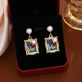 Detailed macro view of French-style tulip enamel earrings in a luxury jewelry box - E7287/Tulip Floral Pearl Earrings