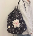 Detail of black backpack with bear prints featuring a plush bear charm and metal tag - With 1A Pendant and Bib Bear / Black