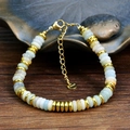 Adjustable stainless steel beaded bracelet with light green and cream natural stones - Amazonite