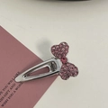 Detail of pink rhinestone bow hair clip on a silver base with heart-shaped patterns - Silver/Pink Zirconia-Small Bow