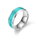Detailed macro view of the luminous heart and heartbeat engraving on silver titanium ring - US 6 / Green - Luminous EKG