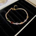 Macro shot of gold-plated tennis bracelet with multi-colored gems in a black velvet box - Six-Color Main Stone Tennis Chain Style / Gold-Colorful (True Gold Plated)