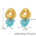 Detail of gold stainless steel knot earrings with light blue glass beaded tassels - Twisted Knot Blue Cluster Style (F1487)