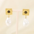 Detailed macro view of gold evil eye earrings with irregular baroque pearl pendants - Gold Evil Eye (KE115795-GC)