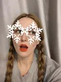 White snowflake party glasses for Christmas celebrations worn by a person - White Snowflake