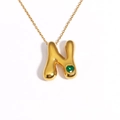 Detail of 18k gold plated puffy bubble letter N pendant with a green heart gemstone - Letter N